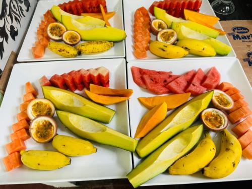 a plate of fruit and vegetables on a table at Rock Grand View in Ella