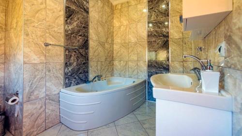 a bathroom with a toilet and a sink at Villa atılgan in Kaş