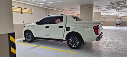 a white truck parked in a parking lot at Antara Residence Studio Condo in Talisay