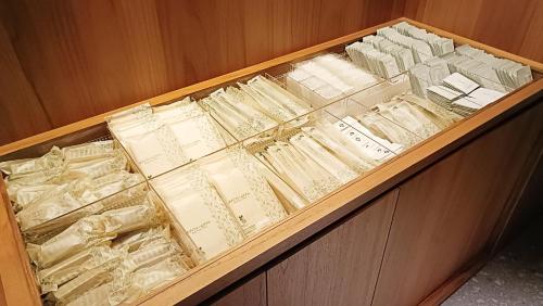a drawer filled with lots of books and papers at Hotel Grand Bach Kyoto Select in Kyoto