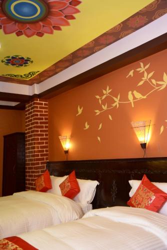 Postel nebo postele na pokoji v ubytování Kasthamandap Boutique Hotel