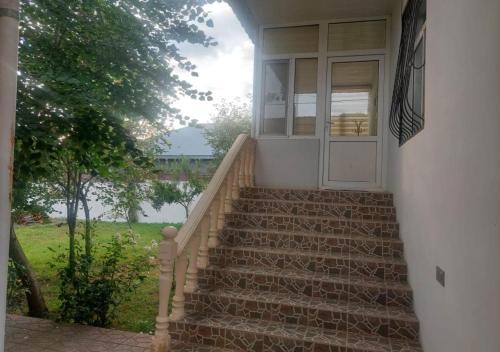 a set of stairs leading to a door on a house at Ali Baba Residence in Gabala