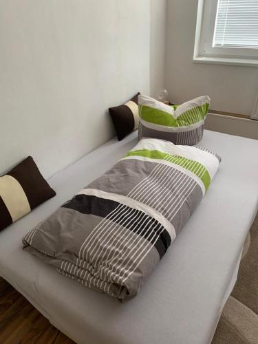 a bed with two pillows on it in a room at Idylle in Thale