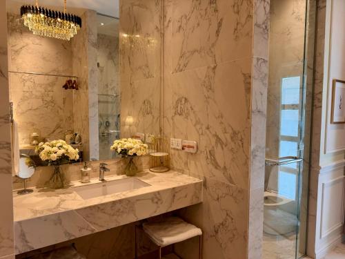 a bathroom with a sink and a shower at The Atlantic Langkawi in Pantai Cenang