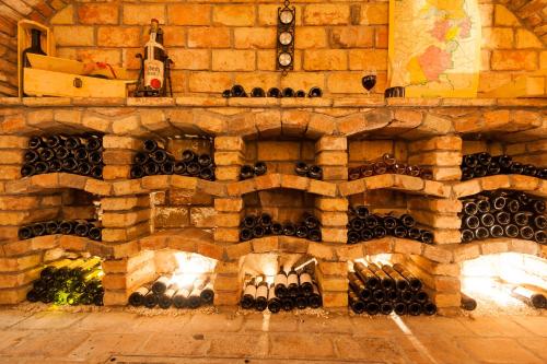 a wall filled with lots of wine bottles at Hotel Der Waldhof in Zell am See