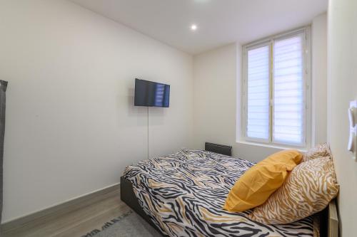 Ένα ή περισσότερα κρεβάτια σε δωμάτιο στο Cozy Corner 77 - Appt avec jardin pour 4