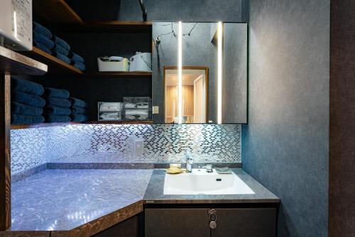 a bathroom with a sink and a tub at Grand Piano & Shinjuku 5min walk from station in Tokyo