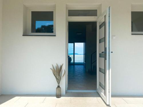 Gambar di galeri bagi BALATON A KERTBEN - BALATON IN THE GARDEN - Beachfront houses with beautiful view, private beach di Balatonfenyves