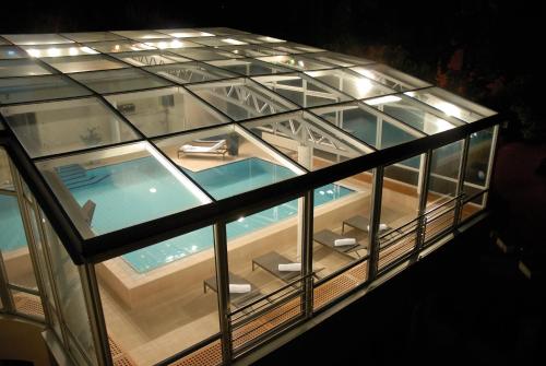 an overhead view of a glass building with a swimming pool at Hotel Villa Vera in Lovran
