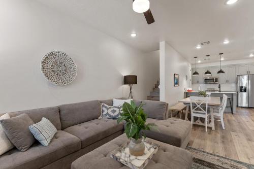 a living room with a couch and a table at Sun, Sand, and Smiles #100 condo in St. George