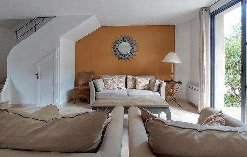 a living room with a couch and a table at Cozy Home In Saint-Laurent-De-La-Ca With Wifi in Saint-Laurent-de-la-Cabrerisse