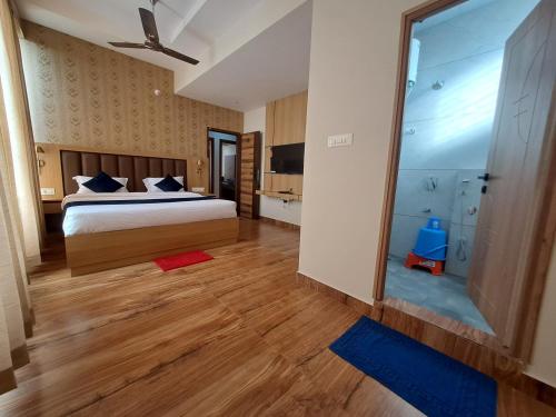 Postel nebo postele na pokoji v ubytování Sky Inn