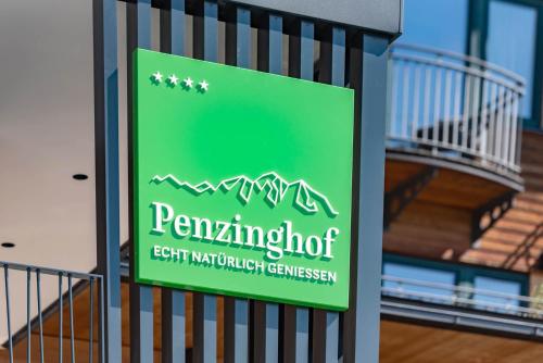 a sign on the side of a building at Hotel Penzinghof in Oberndorf in Tirol