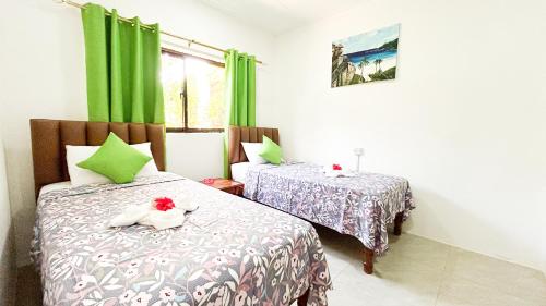 Postel nebo postele na pokoji v ubytování Anse Grosse Roche Beach Villa