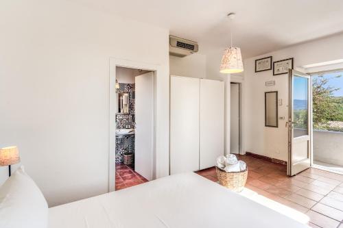 a bedroom with a bed and a view of a room at Casale Giancesare Villa Agricola in Capaccio-Paestum