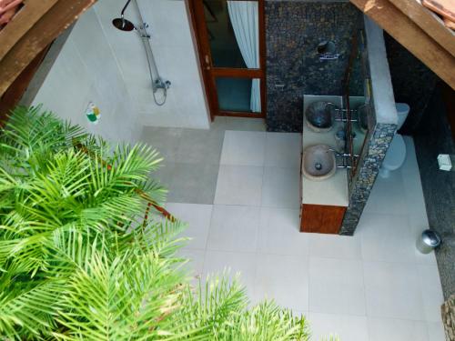 an overhead view of a bathroom with a shower at Jungle Paradise in Nusa Penida