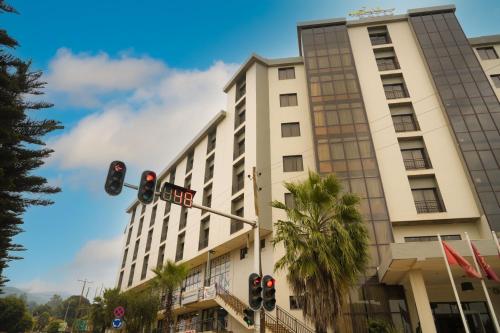 a white building with a traffic light in front of it at Haile Hotel Wolaita in Sodo