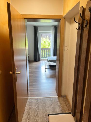 a hallway with a door leading to a living room at Sunside Apartments in Bad Mitterndorf
