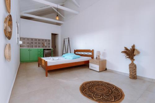 a bedroom with a bed and a rug at Burano Camping Beach-Bar in Néa Thésis