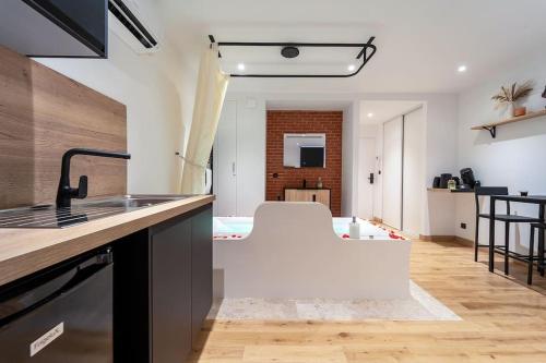 a kitchen with a sink and a counter top at La bulle urbaine in Nancy