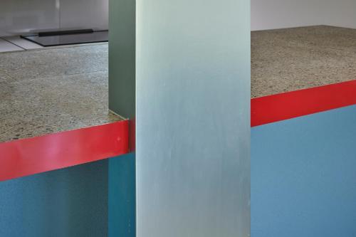 a colorful wall with a counter in a room at Makiba in Hokuto