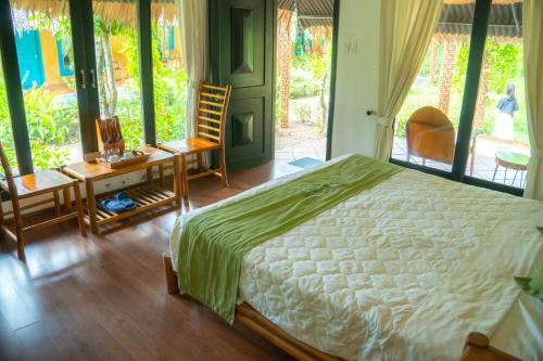 Ένα ή περισσότερα κρεβάτια σε δωμάτιο στο Mekong Lodge Resort