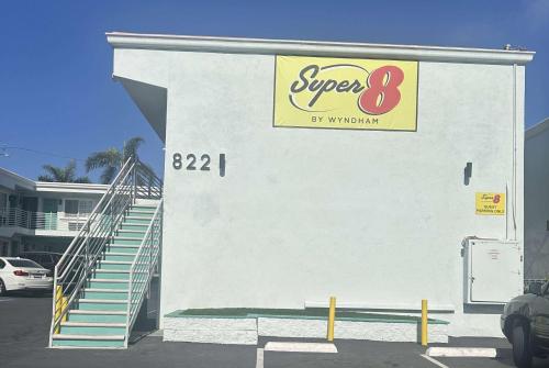 a building with a sign on the side of it at Super 8 by Wyndham Oceanside Downtown in Oceanside