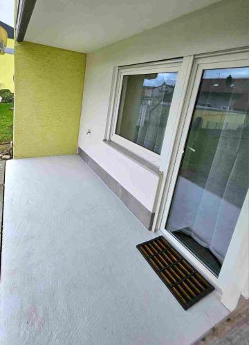 an empty room with a window and a floor at Ferienwohnung Lottstetten in Lottstetten