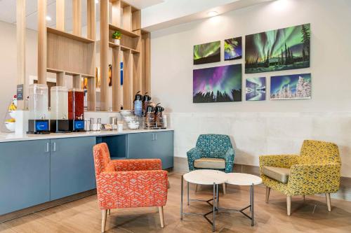a waiting room with two chairs and a table at Comfort Inn Fairbanks in Fairbanks