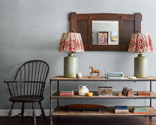 a table with a chair and two lamps on it at Graduate by Hilton Storrs in Storrs