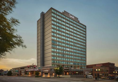 a tall building with a sign on top of it at Graduate by Hilton Lincoln in Lincoln