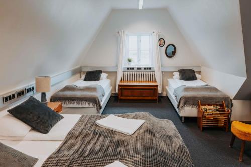 Voodi või voodid majutusasutuse Héradsskólinn Historic Guesthouse toas
