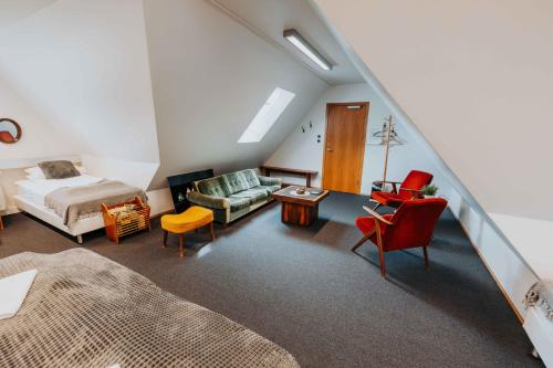 Postel nebo postele na pokoji v ubytování Héradsskólinn Historic Guesthouse