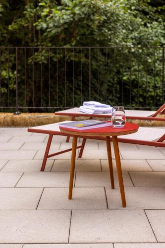 two picnic tables with plates on top of them at schlossmühle - lean luxury boutique hotel in Glottertal