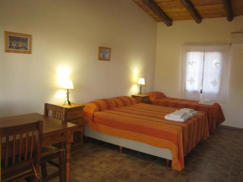 La Trinidad Casa de Campo tesisinde bir odada yatak veya yataklar