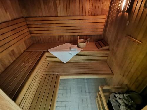 an overhead view of a small sauna with a bucket at Hotel Rajská zahrada in Nové Město nad Metují