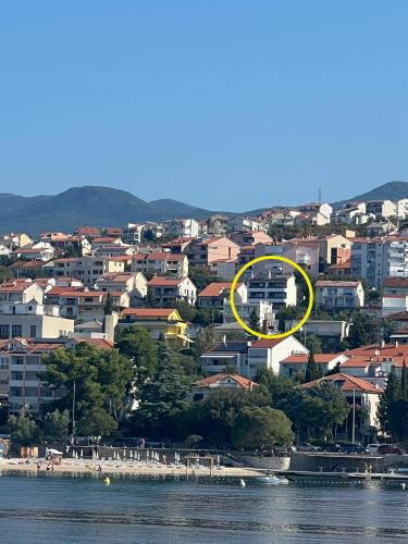 a view of a city with a yellow circle at AppMishadze in Crikvenica