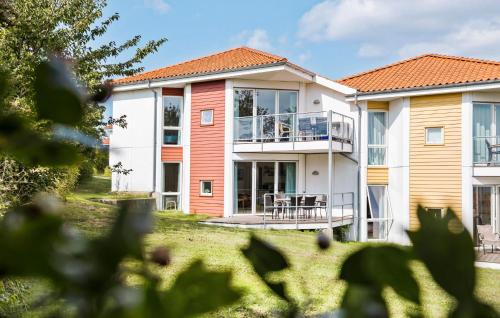 a view of a house with a yard at Gudhjem Søpark Lejl 51 in Gudhjem