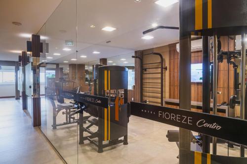 a store with a large glass window with a store counter at Hotel Fioreze Centro in Gramado