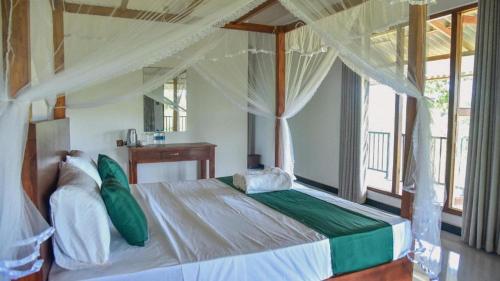 Postel nebo postele na pokoji v ubytování Sigiriya Paradise Inn