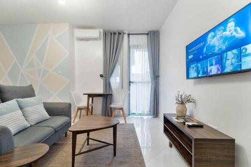 a living room with a couch and a table at Sigma Base Apartments in Lagos