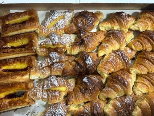 a box full of croissants and other pastries at Hotel Principe Di Piemonte in Rome