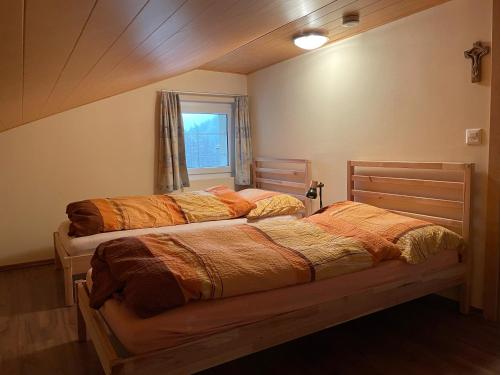Postel nebo postele na pokoji v ubytování Cresta Loft in Saas-Grund