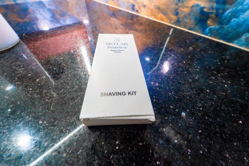 a white book sitting on top of a table at Skylar Seaview Beach Resort & Ayurveda Varkala in Varkala