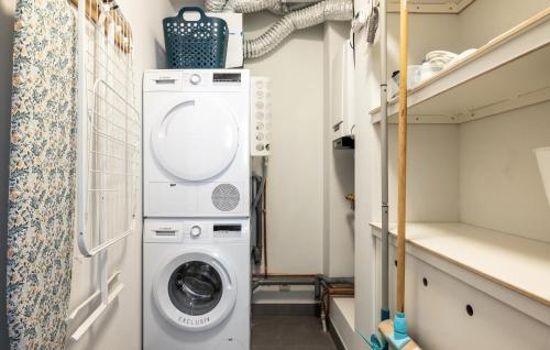 a laundry room with a washer and dryer at Westergeest Luxe in Uitgeest