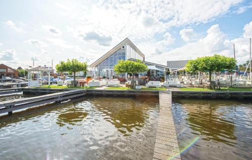 a building next to a body of water at Kraaijennest in Uitgeest