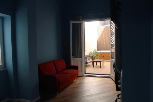 Ein Sitzbereich in der Unterkunft FALSTAFF Rooms & Suites