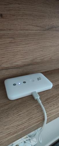 a white wii controller sitting on top of a table at Студио Нико - Царево in Tsarevo