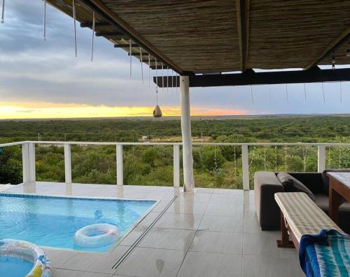 a swimming pool on a balcony with a view at Sunset Villa 44 in Mateus