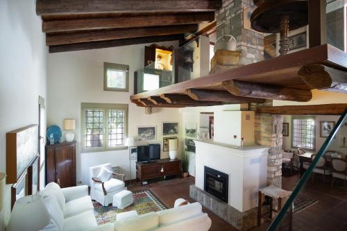 a living room with a fireplace and a couch at Oasi Dolce Vita in Lozzo Atestino